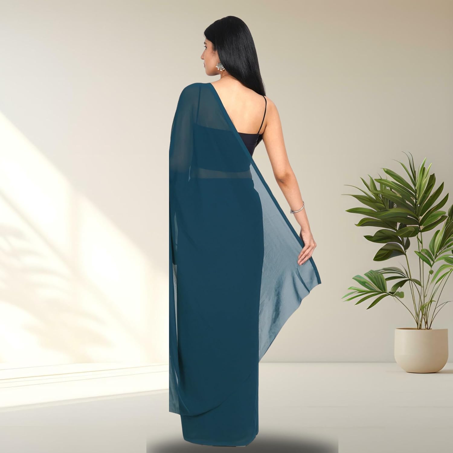 1752463908_kavipushp-Teal-Blue-Georgette-Saree-with-Unstitched-Blouse-Piece-Lightweight-Plain-Saree-for-Women-Perfect-for-regular-Wear-Office-Wear-Casual-Occasions.jpg